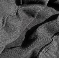 a close up of a black hooded sweatshirt